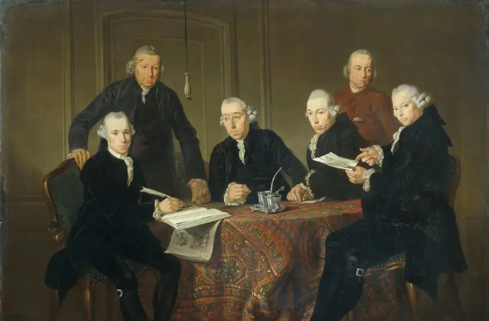 group of people sitting on brown wooden chair